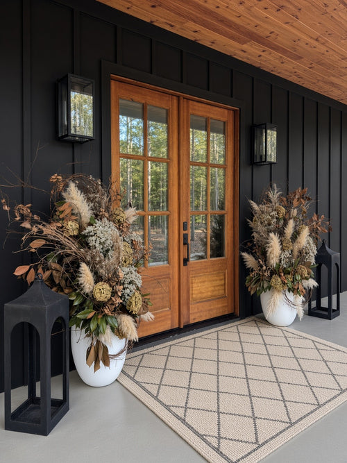 Autumn Planters seen from the side beside wood double doors and a black lantern