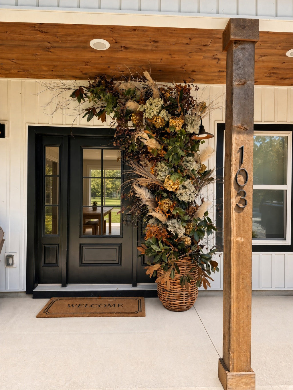 Welcome Home Arch - HALF rising from a woven basket beside a black front door